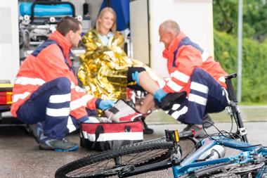 Paramedics helping bicycle accident victim