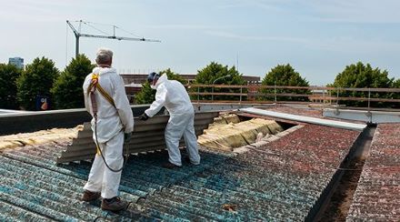 Two men being exposed to asbestos while on the job