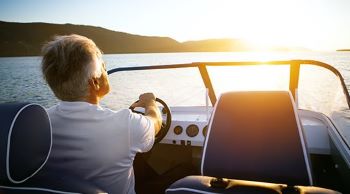 Man steering a boat