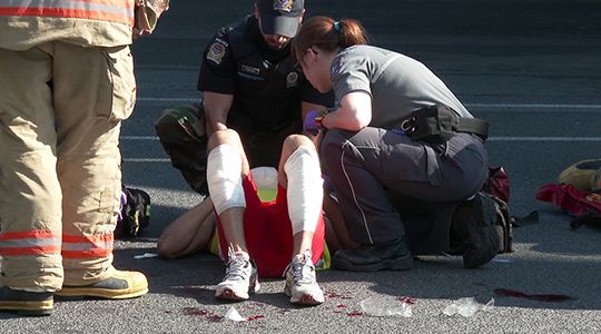 Injured pedestrian receiving aid